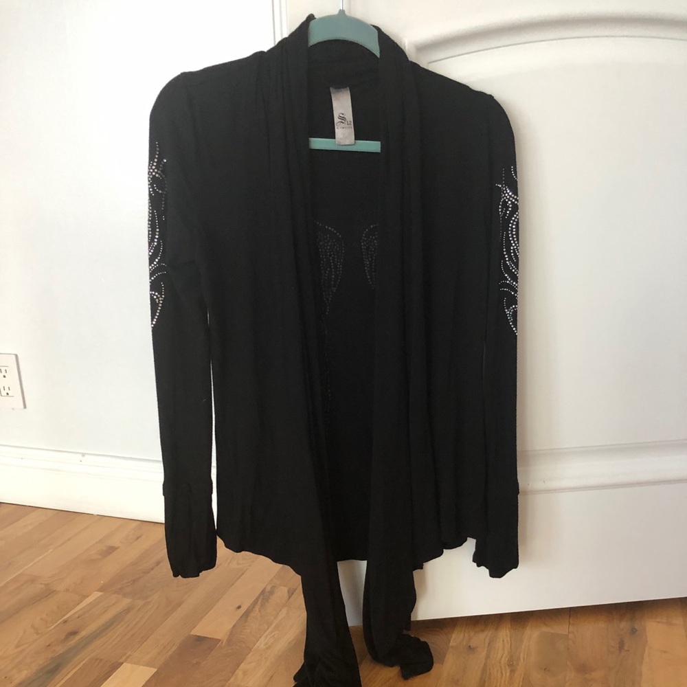 Asymmetrical embellished sleeves and back